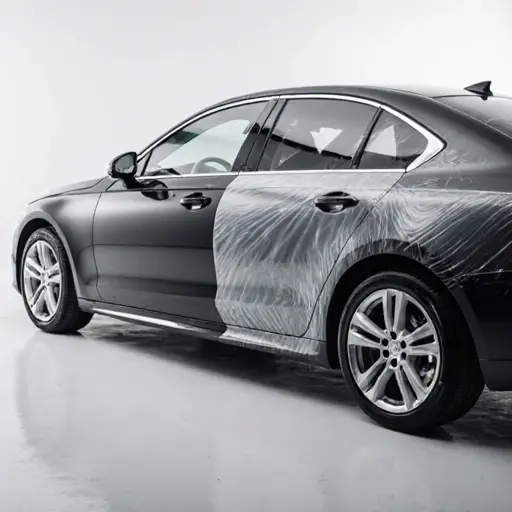 Half car covered with Dupotop Paint Protection Film showing glossy reflection and smooth surface | Dupotop Films